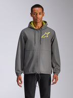 Alpinestars Speeder Chromium Windbreak Jacket, casaco corta-vento cinzento com capuz, logótipo de estrela amarelo néon, interior do capuz verde-limão, punhos elásticos, cordões ajustáveis, fecho de correr frontal, estilo casual de desportos motorizados