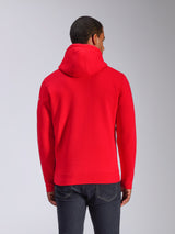 Alpinestars Frontal Hoodie, hoodie de lã vermelho, vista traseira mostrando capuz com cordão e bainha canelada, pequeno logótipo branco na manga, streetwear casual inspirado no desporto motorizado