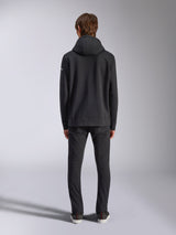 Alpinestars Frontal Hoodie, casual streetwear, black, rear view of model wearing pullover fleece hoodie, featuring ribbed hem and cuffs, small white wordmark logo on sleeve, paired with black pants