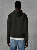 Alpinestars Essentials Ageless Zip Hoodie, back view of a relaxed fit hoodie in Off Black, worn with a white t-shirt and blue jeans, clean and understated motorsport-inspired sportswear.