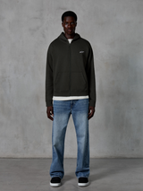 Alpinestars Essentials Ageless Zip Hoodie, Full-Zip Hoodie, Off Black, featuring a small white Alpinestars logo on the chest, worn by a model with a white t-shirt and blue jeans, relaxed fit, casual motorsport streetwear