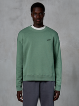 Alpinestars Essentials Ageless Crew, sweatshirt casual de gola redonda, verde Cactus com um pequeno logótipo de estrela preto no peito, gola, punhos e bainha canelados, em fleece compacto premium