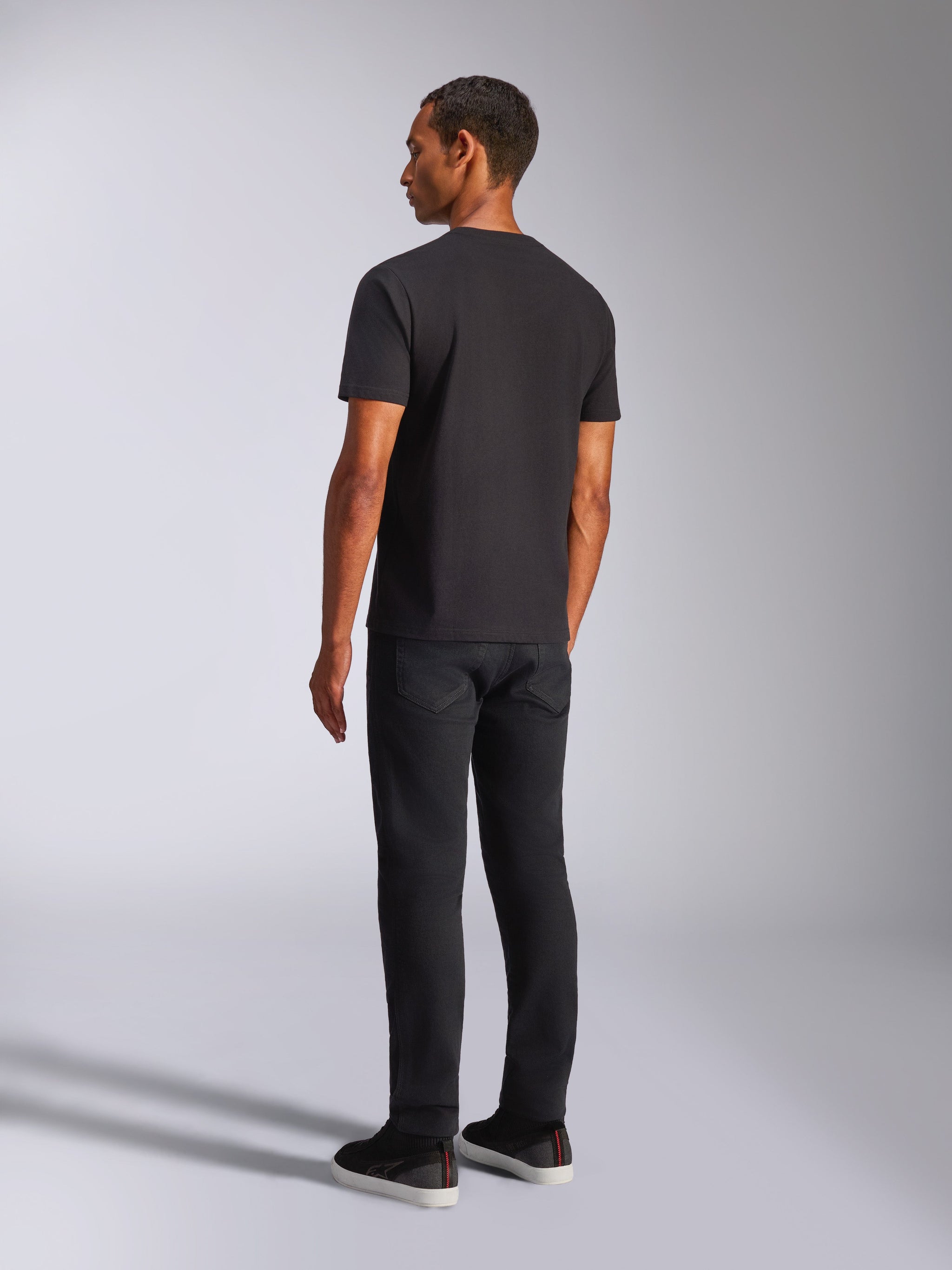 Alpinestars Shaded CSF Tee, Short Sleeve T-Shirt, Black, back view of male model wearing black pants and casual shoes, lifestyle motorsport apparel