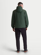 Casaco Alpinestars Speeder Resolve Corta-Vento, corta-vento leve para homem em verde, vista traseira com capuz e punhos elásticos, casual sportswear.