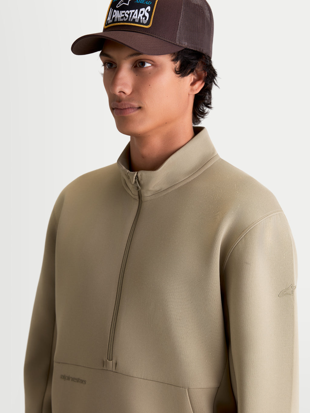 Alpinestars Apera Half-Zip Sweatshirt, Putty Beige Sportswear Pullover, featuring tri-blend double-face fleece, half-zip closure, and tonal branding. Casual motorsport-inspired apparel for everyday wear shown on-model.