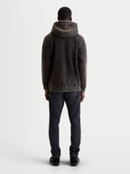 Alpinestars camisola com capuz Infinite Washed Oversized, camisola de sportswear casual unissexo, preto lavado, fleece macio com acabamento snow-wash, vista traseira mostrando o ajuste descontraído, detalhe do capuz e bainha canelada.