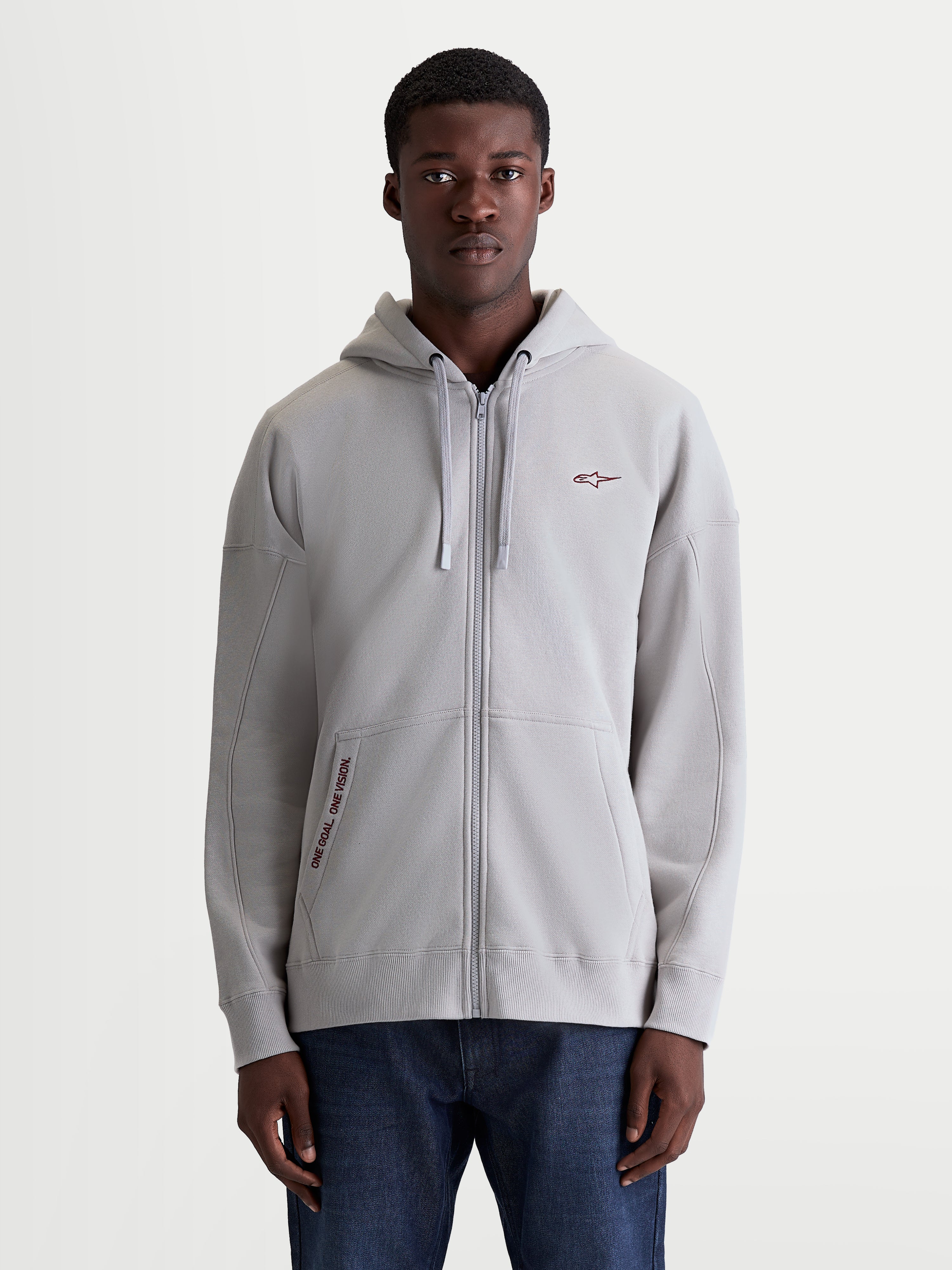 Alpinestars Pioneer Oversized Hoodie, camisola com capuz para homem, cinzento-cimento, fecho Vislon integral, bolso canguru com bordado One Goal One Vision, corte oversized descontraído, sportswear casual.