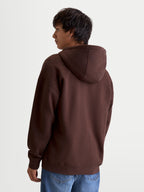 Alpinestars Entity Oversized Hoodie, Sportswear Lifestyle Hoodie, Men's, Brown, Recycled Cotton Blend, Back View on Model highlighting the oversized silhouette and hood detail.