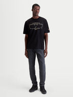 Alpinestars t-shirt Infinity Oversized CSF, t-shirt de manga curta para homem, preta com gráfico frontal técnico branco, corte oversized para conforto casual e estilo motorsport, mostrada num modelo.