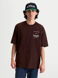 Alpinestars T-Shirt Post Oversized CSF, t-shirt de manga curta para homem em castanho, com logótipo Astars e estampado 'One Goal. One Vision.' na frente, corte oversized relaxado para estilo casual e sportswear.