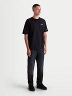 Alpinestars T-Shirt Mandate Oversized CSF, t-shirt de manga curta para homem, preta com logótipo branco em puff-print, corte oversized descontraído, casual sportswear.