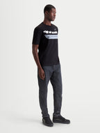Alpinestars Singular CSF Tee, Men's Short Sleeve Sportswear T-Shirt in Black, featuring a white curved Astars word graphic and 'One Goal One Vision' print, premium combed ring-spun cotton blend for casual everyday comfort and motorsport style.