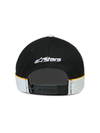 Alpinestars Boné 500 Snapback, boné de estilo sportswear, preto e branco com pormenores amarelos, vista traseira com fecho snapback ajustável, logótipo Astars bordado a branco e detalhes de corte e costura com debrum em contraste.