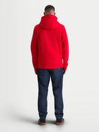 Alpinestars camisola com capuz Ageless Zip V3, sweat de fleece vermelha para homem, vista traseira no modelo, design de capuz confortável com punhos e bainha canelados, estilo motorsport casual.