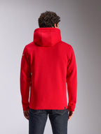 Alpinestars Linear Wordmark V3 Hoodie, rear view of a red hooded pullover fleece, featuring a white Ageless logo on the sleeve, ribbed cuffs and hem, casual motorsport-inspired streetwear