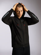 Alpinestars Sessions V3 Hoodie, black full-zip hoodie, grey Astars branding on forearms, mesh-lined hood with red-tipped drawcords, casual motorsport-inspired streetwear