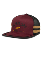 Alpinestars Backline Trucker Hat, boné de malha bordô e preto, logótipo de estrela amarelo e gráfico heritage "Since 1963", copa estruturada com pala plana, riscas laterais amarelo mostarda
