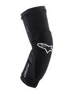 Joelheiras Alpinestars Paragon Plus, pretas e brancas, proteção para BTT, manga em malha respirável tipo slip-on, design ergonómico curvo com logótipo de estrela branco, construção almofadada para condução fora de estrada