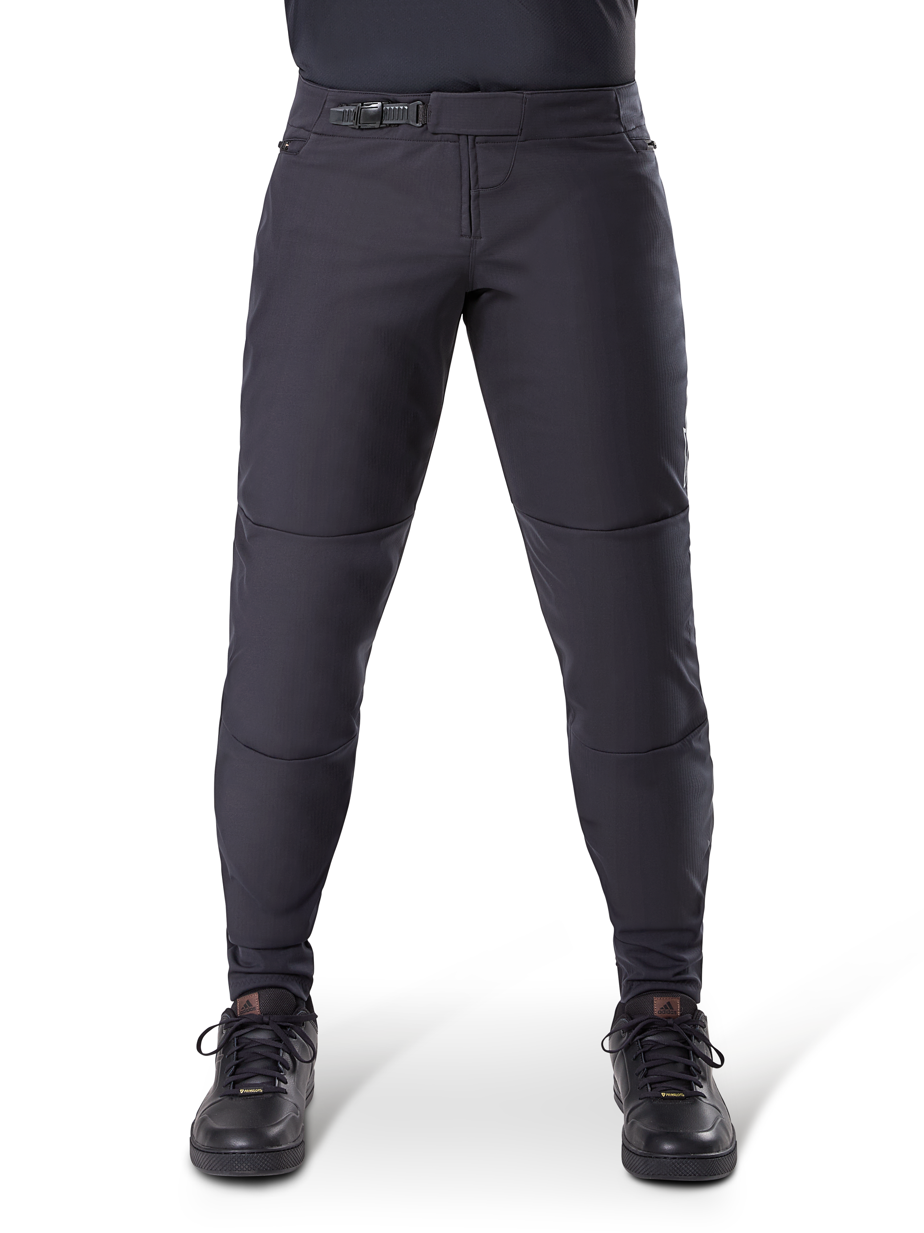 Alpinestars A-Dura Thermal Pant, Black mountain bike pants, featuring a secure ratchet closure and pre-curved fit, worn with black cycling shoes, durable technical material for cold-weather trail riding