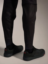 Black A-Dura Elite Flex Pants ankle detail featuring elasticated cuffs and triangular stretch panels for MTB riding.
