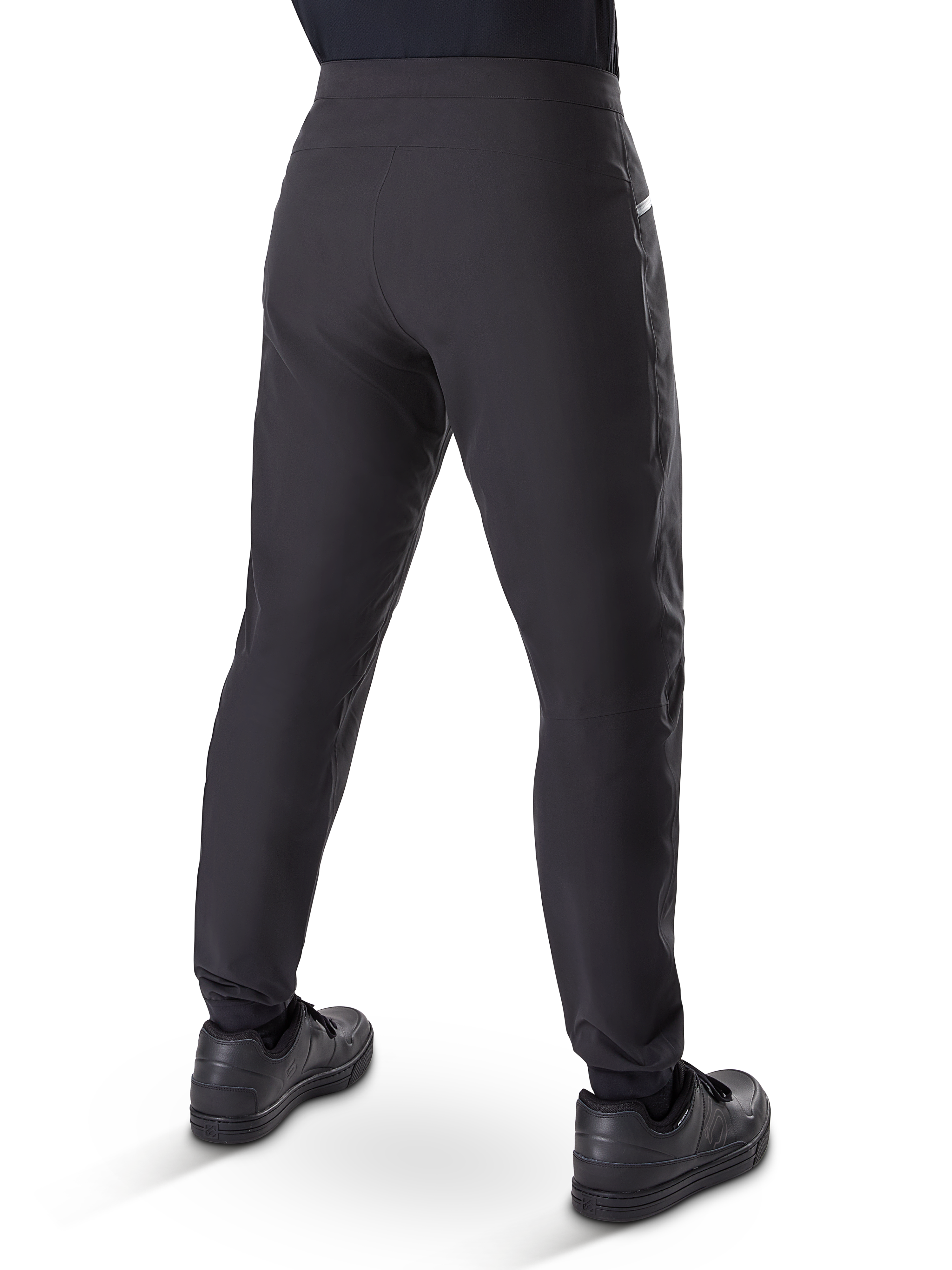 Alpinestars A-Dura Waterproof Pants, Mountain Bike Pants, Black, rear view worn with black shoes, featuring a durable 3-layer membrane, regular fit, and elasticated cuffs for off-road cycling