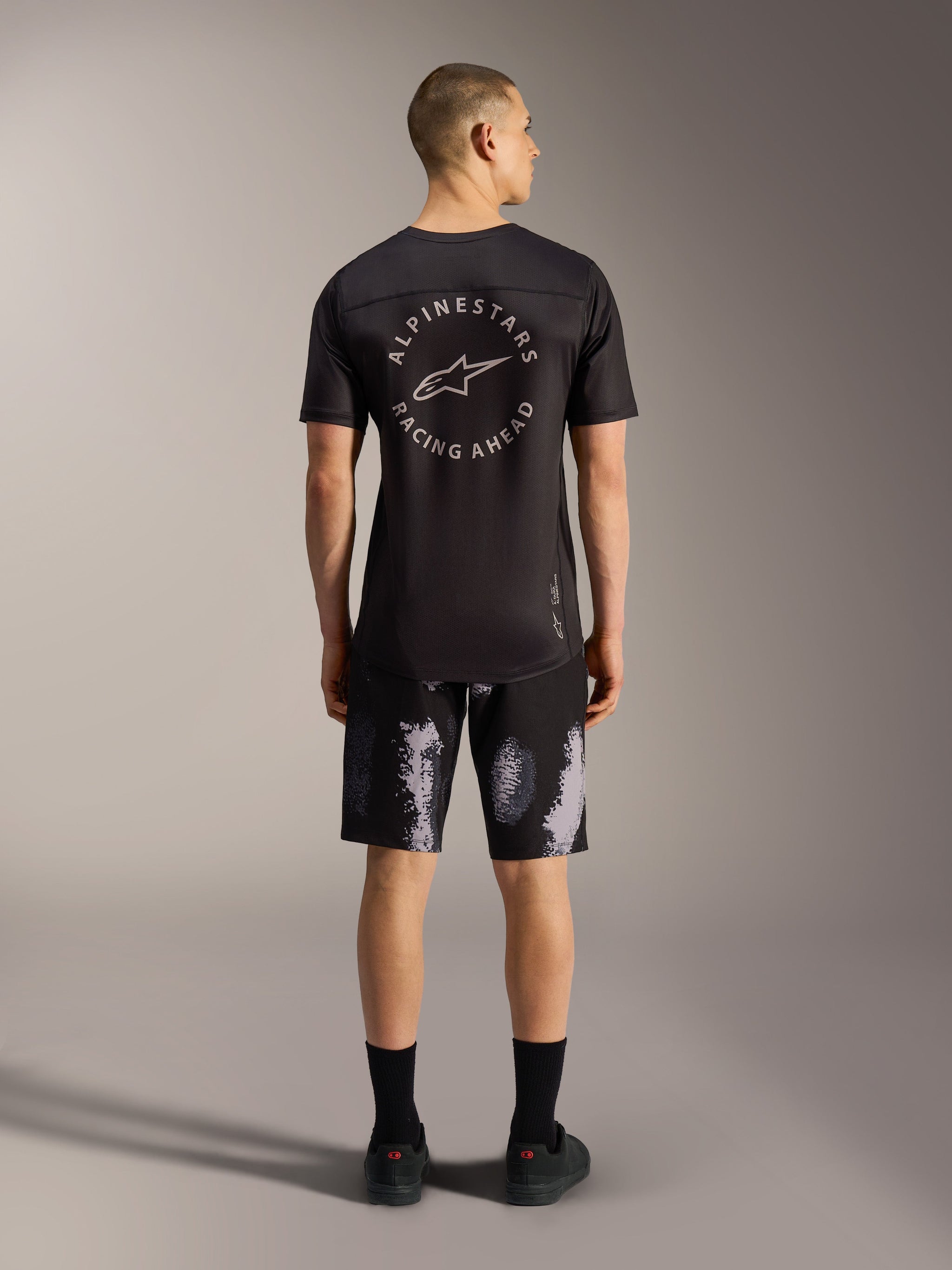 A-Dura Ride Shorts in Black Camo, durable 4-way stretch MTB shorts for men, shown from the back in a studio setting.