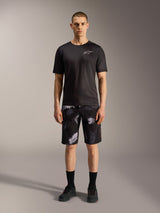 Alpinestars A-Dura Ride Shorts in Black Camo, styled with a black performance tee for mountain bike versatility.