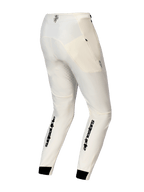 Alpinestars A-Aria Elite Pants, calças de BTT, cor cru, vista traseira com logótipo Alpinestars a preto em destaque na parte inferior das pernas, perfurações de ventilação cortadas a laser e punhos elásticos pretos.