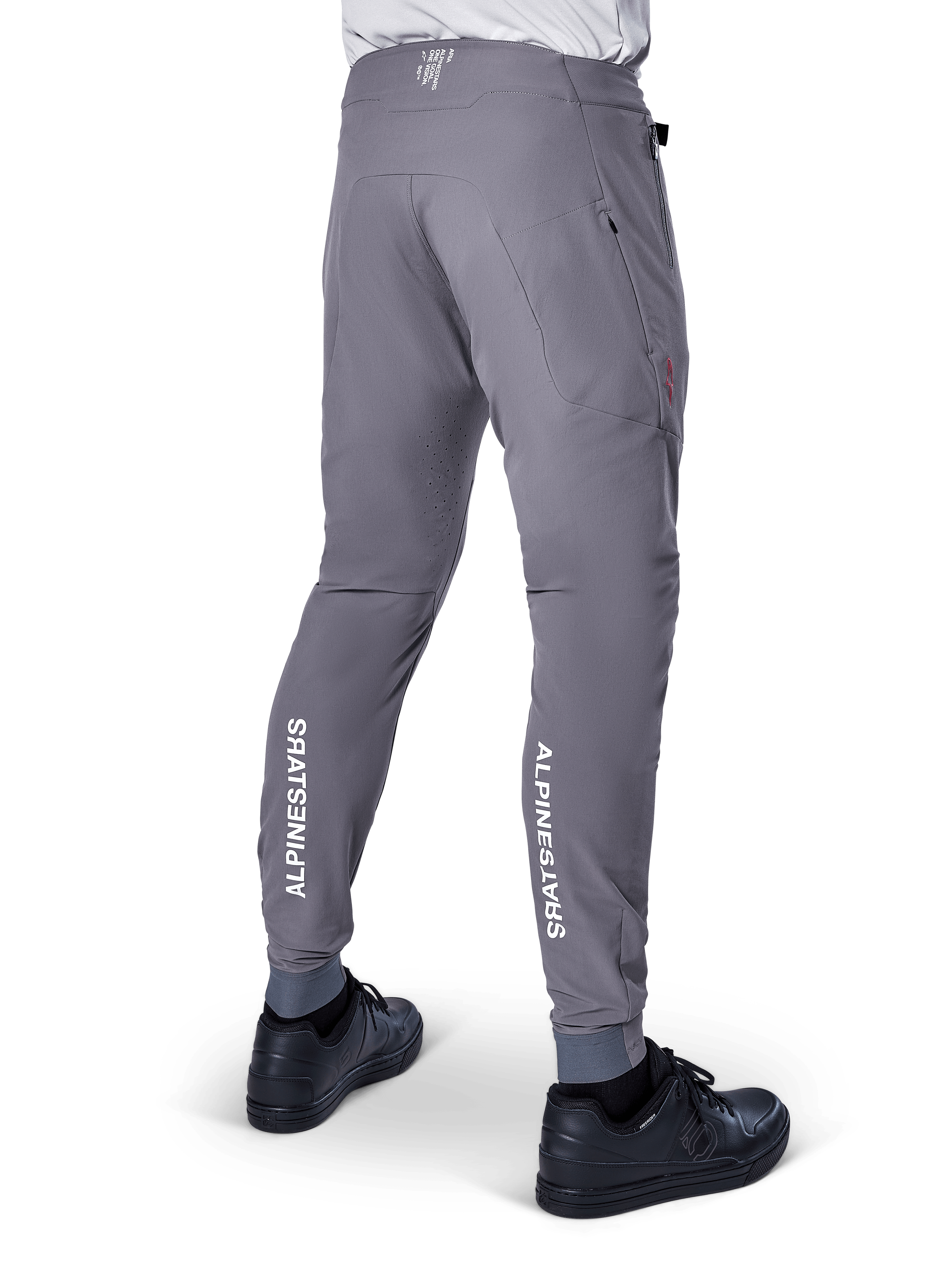 Alpinestars A-Aria Elite Pants, MTB Pants, Dark Gray, featuring vertical white Alpinestars logos on the back of the lower legs, laser-cut ventilation holes, elasticated cuffs, and a performance fit for mountain biking
