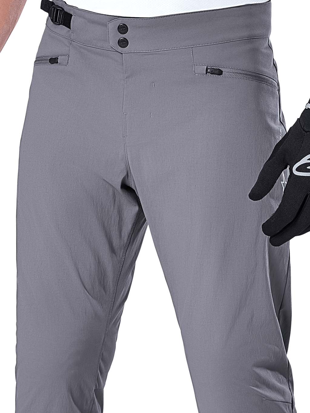 Alpinestars A-Dura Pants, calças de MTB, cinza escuro, grande plano da zona da cintura com fecho duplo de pressão, ajuste lateral e bolsos com fecho de correr, tecido elástico durável para mountain bike