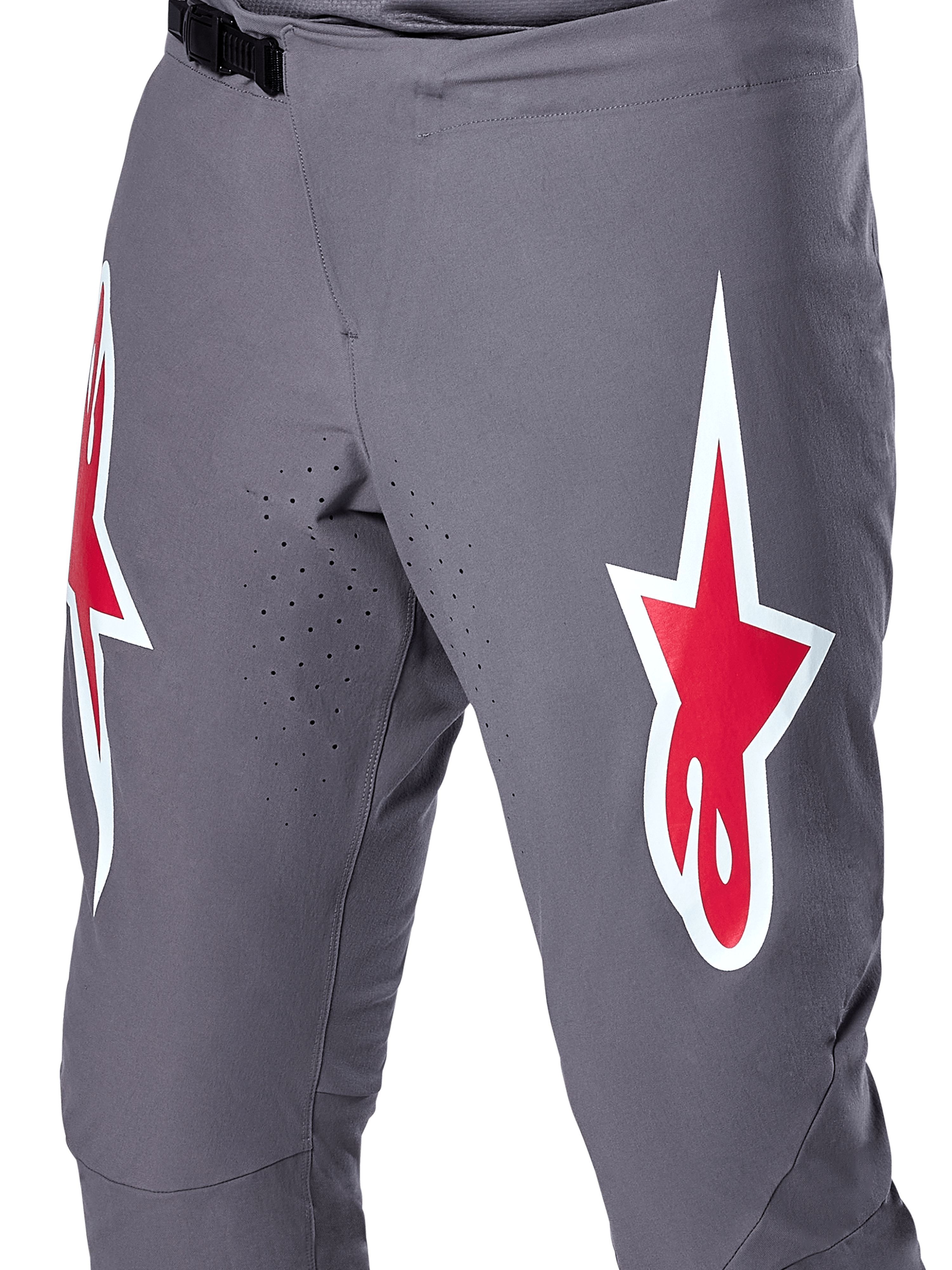 Alpinestars A-Supra Race Pants, MTB Racing Pants, Dark Gray with Red and White logos, close-up view showing laser-perforated ventilation on the inner thighs and a black ratchet waist closure.