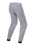 Alpinestars Stella A-Dura Waterproof Pant para Mulher, cinzento Titanium, vista lateral traseira, calças técnicas de BTT com punhos elásticos pretos e um corte afunilado, concebidas para percorrer trilhos com tempo chuvoso