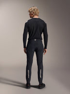 Alpinestars A-Aria Elite Pants, Black Titanium, back view on male model, featuring silver Alpinestars branding on the lower legs, technical MTB pants with a performance fit and moisture-wicking waistband detail.