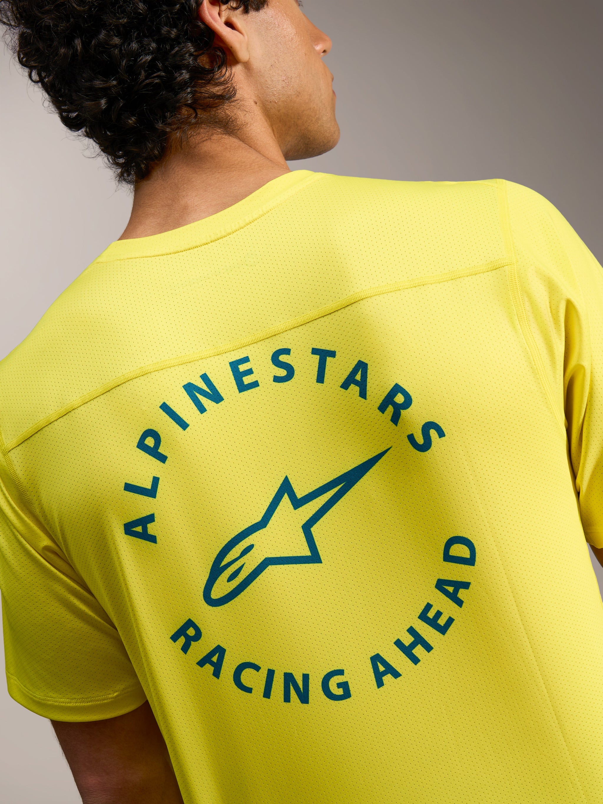 Alpinestars A-Dura Air Jersey in Yellow Fluo with circular Racing Ahead graphic on the breathable mesh back.