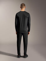 Black A-Dura Ride Long Sleeve Jersey, back view highlighting the drop tail and stretch fabric for MTB performance.