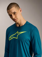 Jersey A-Dura Ride azul esverdeada de manga comprida com logótipo Alpinestars lima, vestuário de BTT de performance.