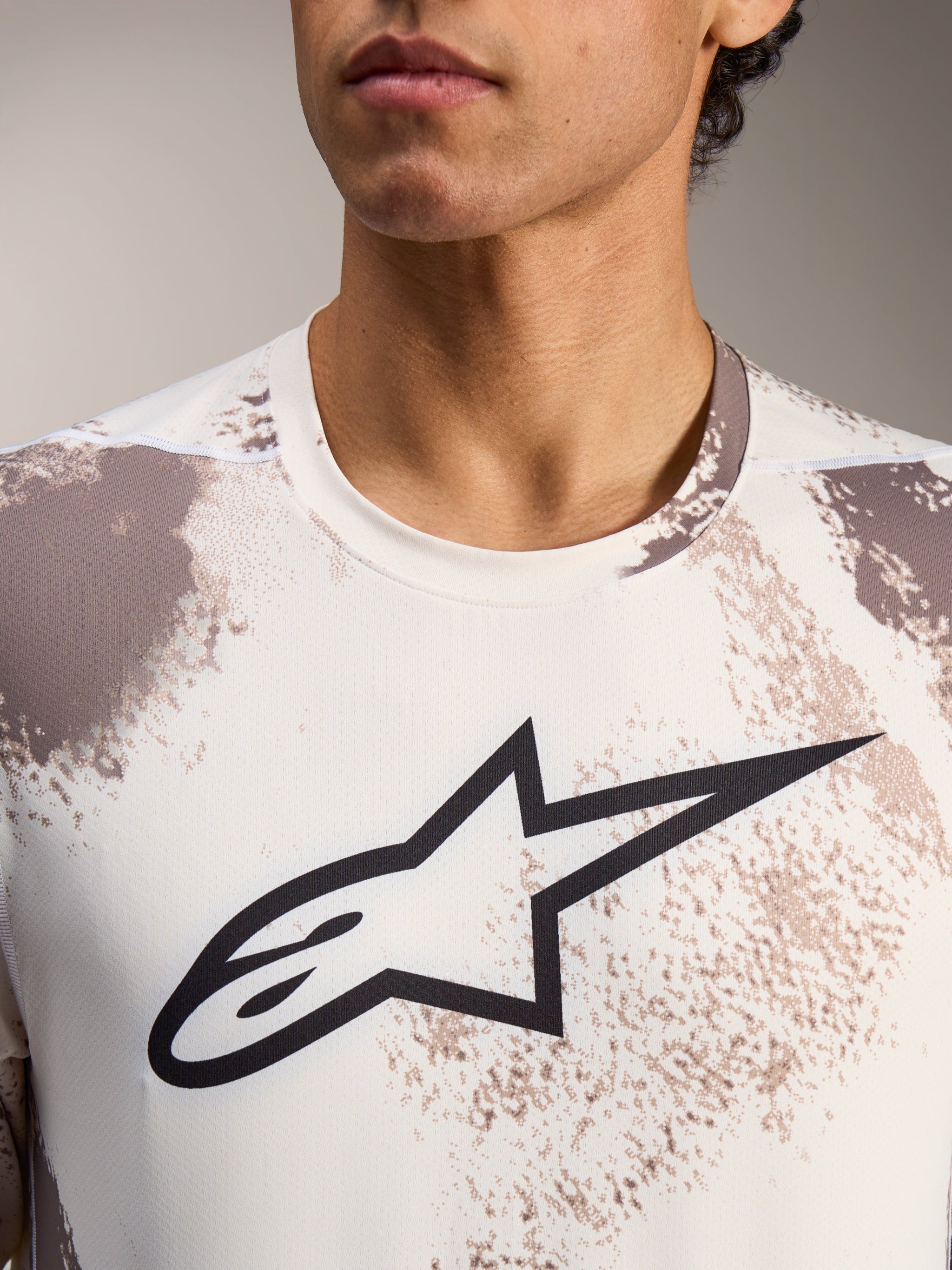 A-Dura Ride Long Sleeve Jersey in Sand Camo, featuring a central black Alpinestars logo and crew neck design.