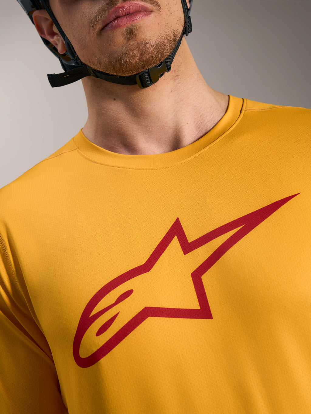 Camisola A-Dura Ride laranja com logótipo Astars vermelho no peito, vestuário de mangas curtas leve para MTB.