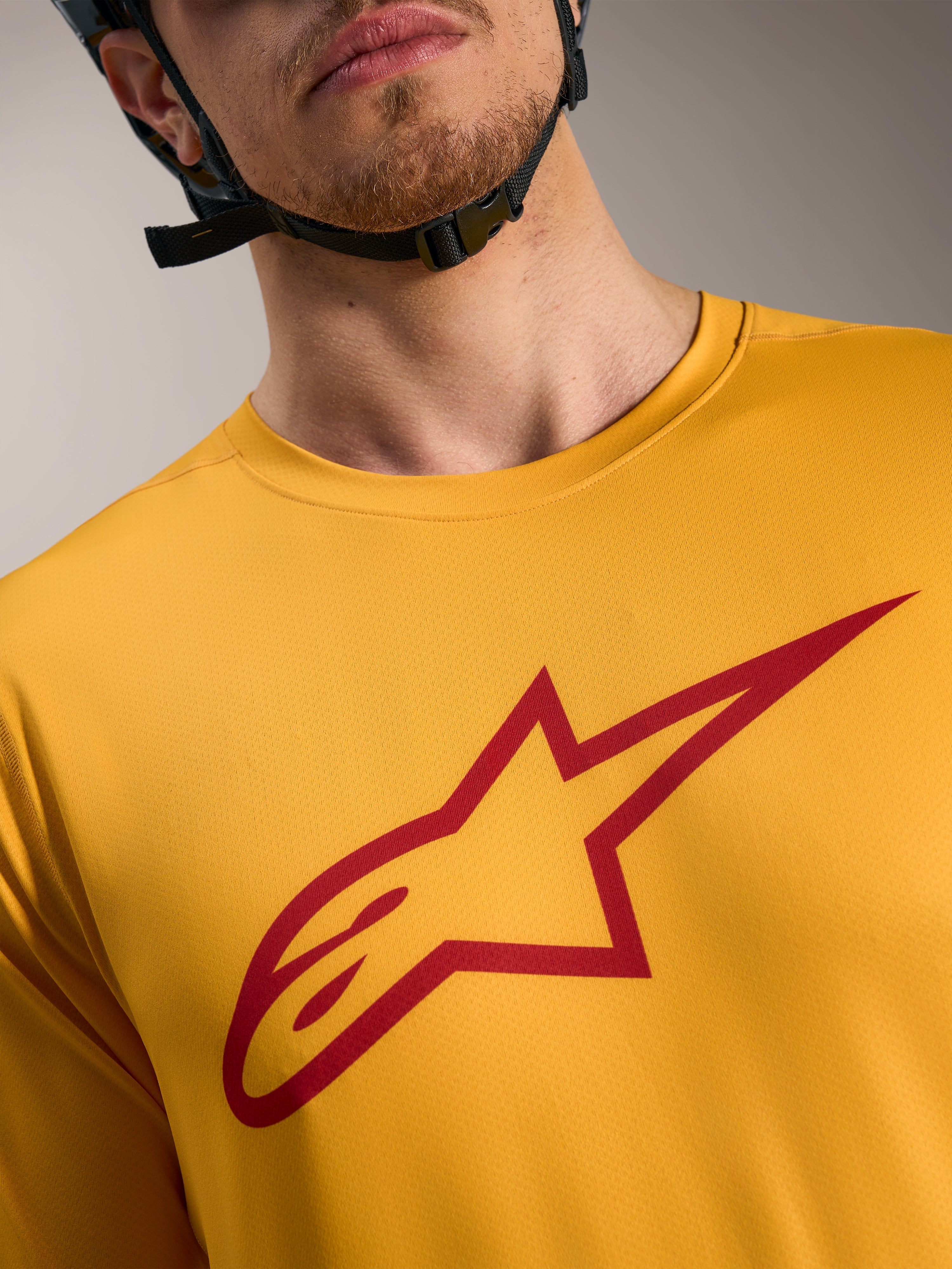 Camisola A-Dura Ride laranja com logótipo Astars vermelho no peito, vestuário de mangas curtas leve para MTB.