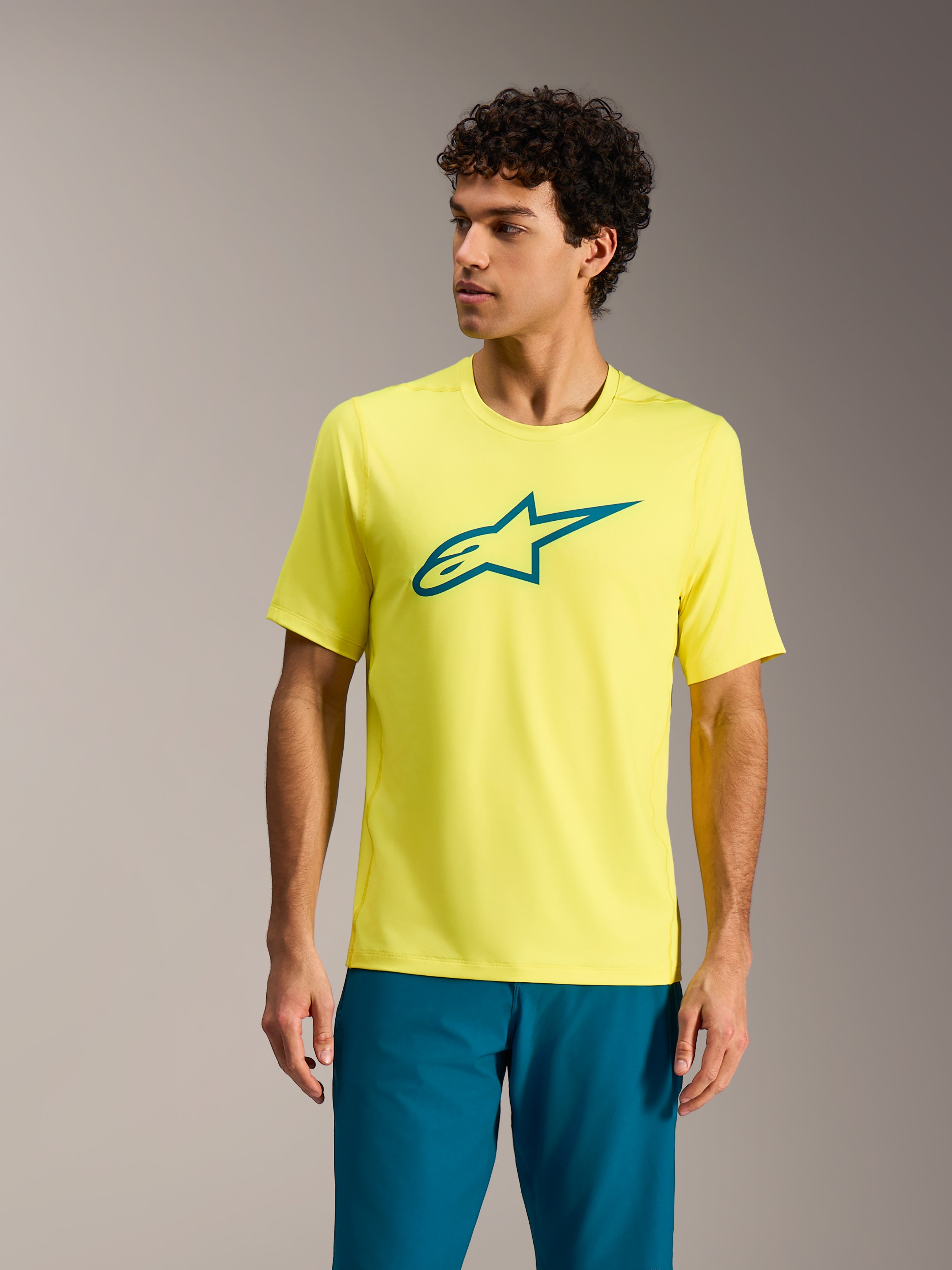 Alpinestars A-Dura Ride Jersey in Yellow Fluo, short sleeve MTB top with teal chest logo, performance cycling apparel