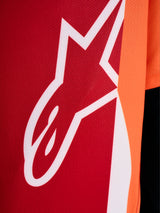 Detail of the A-Dura Race Jersey featuring the white Astars logo on red and orange performance jacquard mesh fabric.