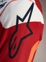 A-Dura Race MTB Jersey, detail of black Astars logo on red, white, and orange breathable jacquard performance mesh.