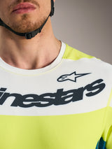 A-Dura Race Jersey in white and lime green, featuring bold Alpinestars branding and breathable mesh fabric construction.