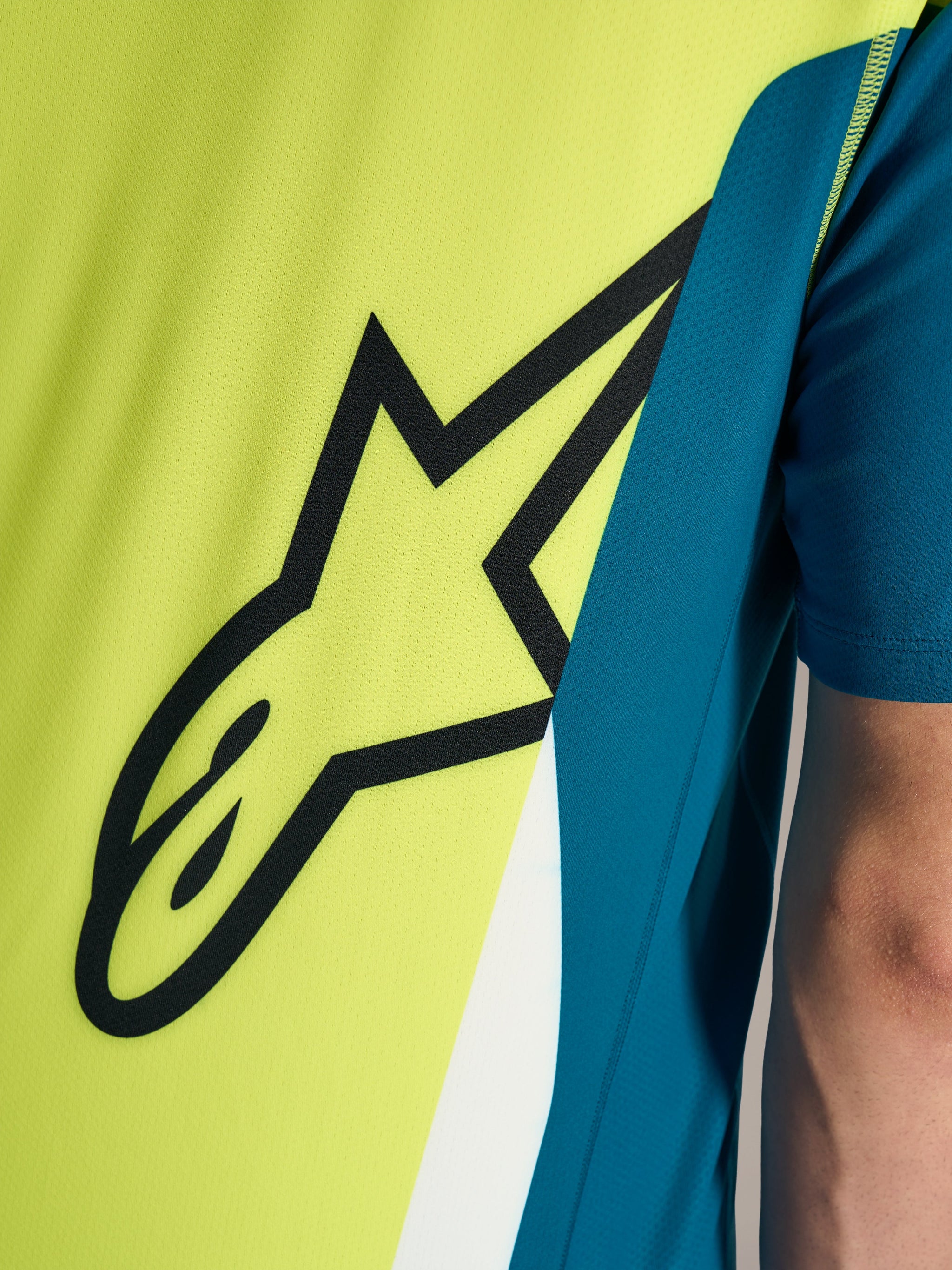 A-Dura Race Short Sleeve Jersey, Blue Green and lime, detailing the black Astars logo on breathable technical fabric.