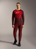 Alpinestars A-Dura Elite Jersey 2.0 Long Sleeve in Bordeaux, featuring a yellow chest logo and red stripes.