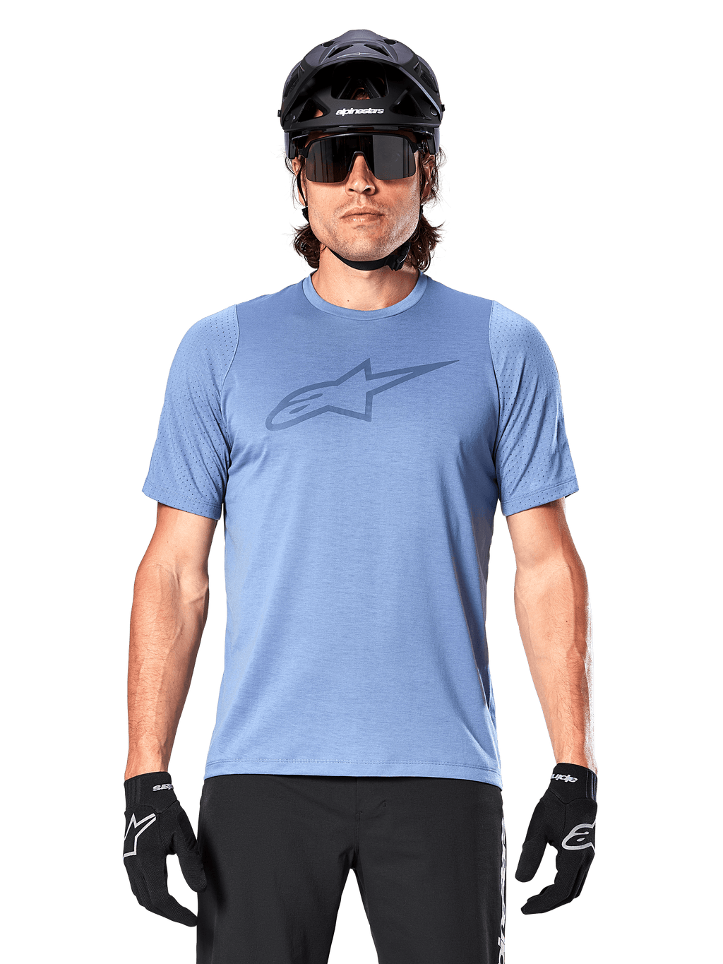 Male mountain biker wearing Alpinestars A-Dura Dri Astar Short Sleeve Jersey in Infinity Blue, featuring a subtle chest logo and mesh panels, paired with a black helmet, sunglasses, and black gloves for a technical cycling outfit