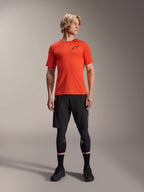 Alpinestars A-Aria Astar Short Sleeve Jersey, Spicy Orange, worn by model with black mountain bike shorts and knee guards, lightweight and breathable performance cycling apparel for MTB