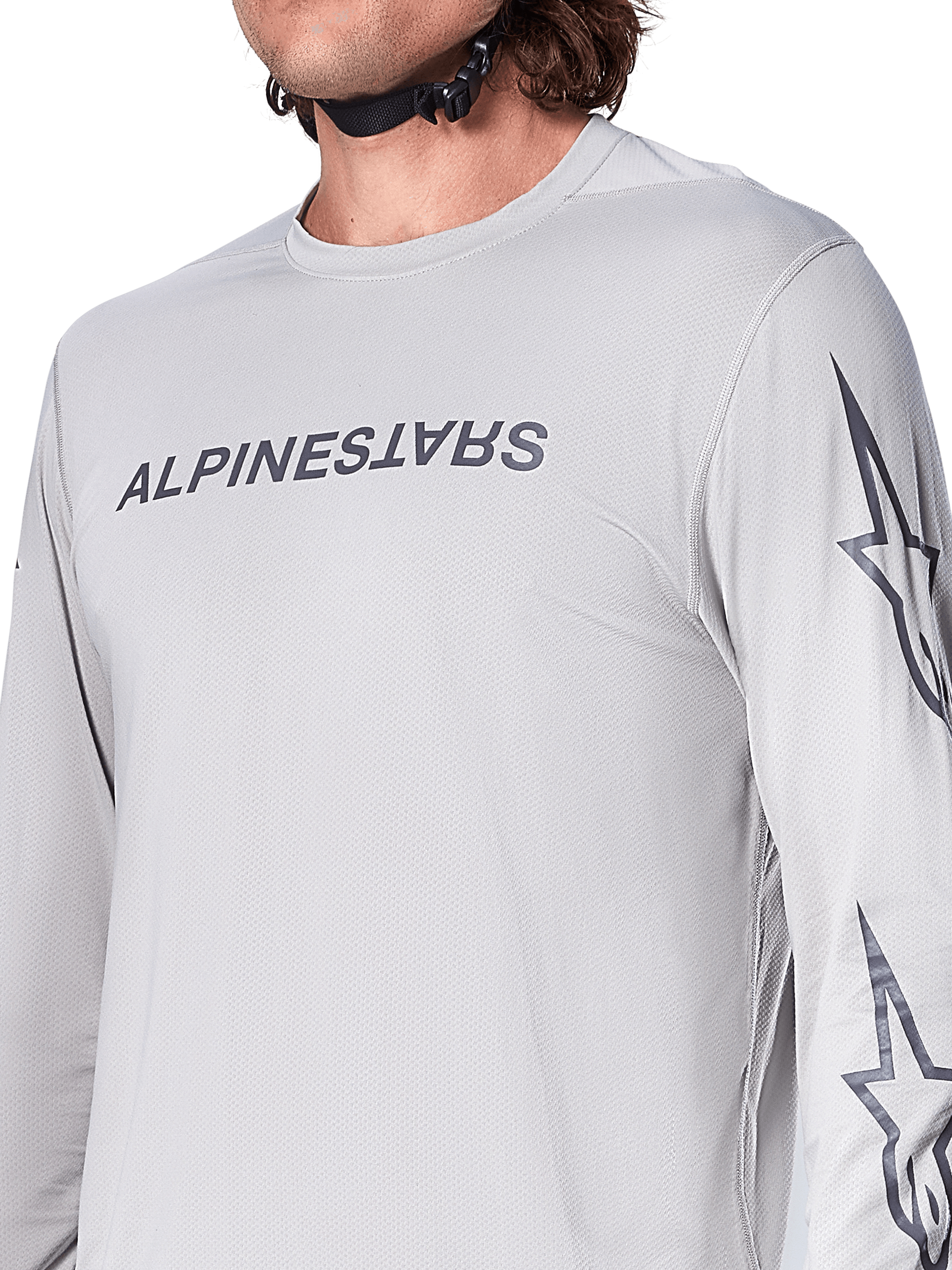 Alpinestars A-Dura Switch Jersey - Manga Comprida, camisola de BTT em cinzento claro com logótipo escrito em cinzento escuro no peito e logótipo de estrela na manga, textura jacquard respirável, equipamento de ciclismo de performance para trilhos