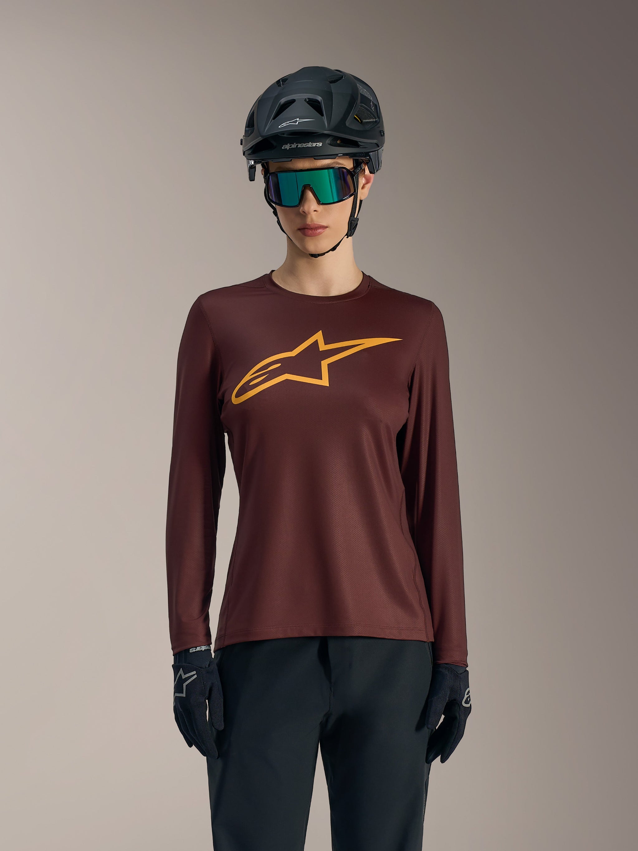 Women's Stella A-Dura Ride Long Sleeve Jersey in Bordeaux, featuring yellow chest logo and casual mountain bike styling.