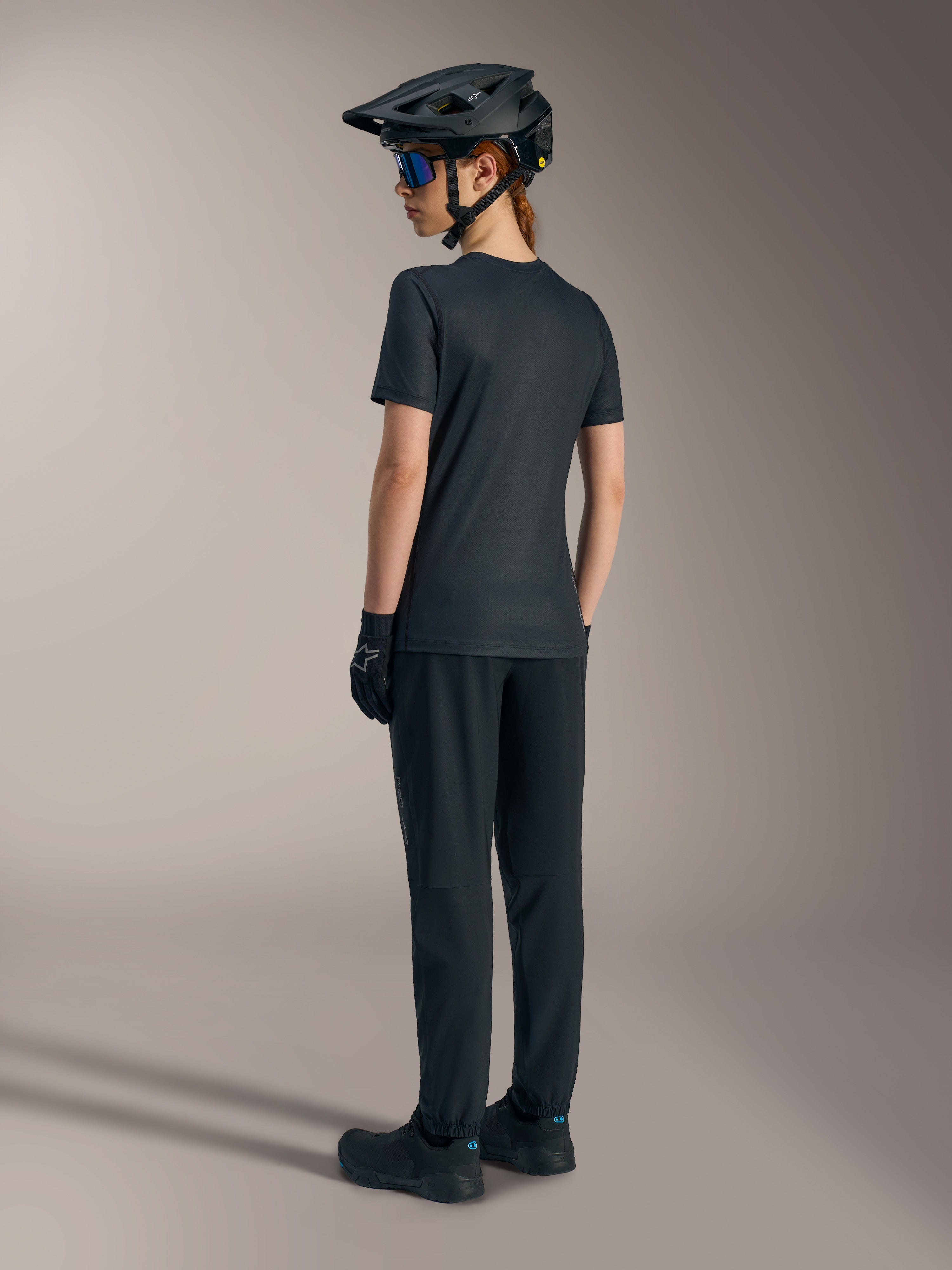 Women's Stella A-Dura Ride Jersey in black, short sleeve jacquard MTB top for performance riding, shown from the back.